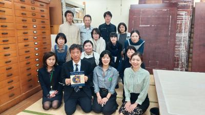 Mito Matsumaru presenting a little gift to Preservation and Conservation team at the National Diet Library