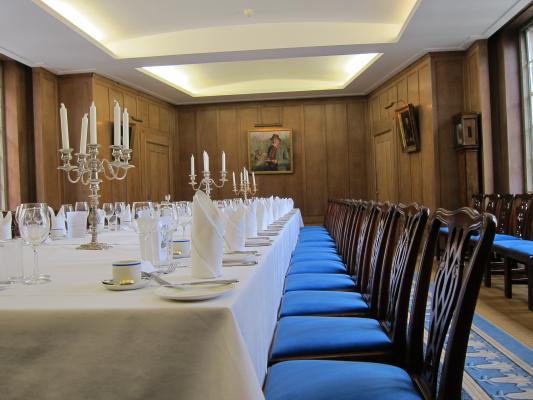 Set table for fine dining in the New Combination Room, Corpus Christi College Cambridge.