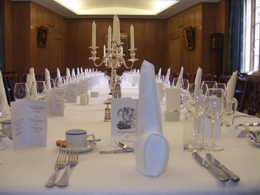 Fine dining set table for dinner in the New Combination Room, Corpus Christi College Cambridge.