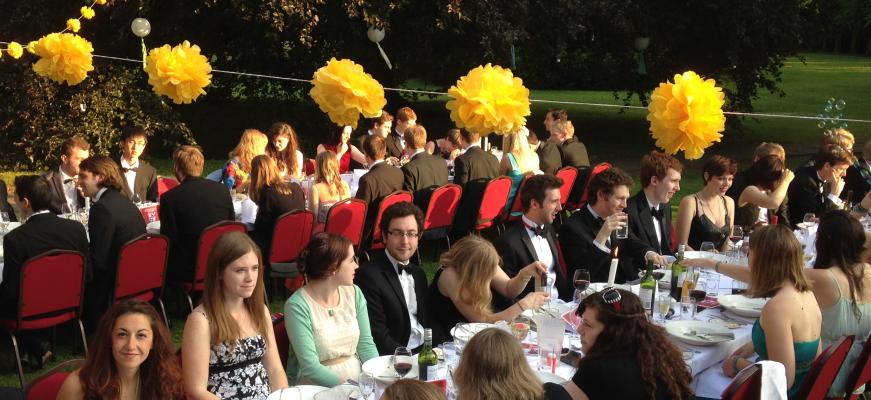 Graduate students at their end-of-year dinner in Leckhampton garden