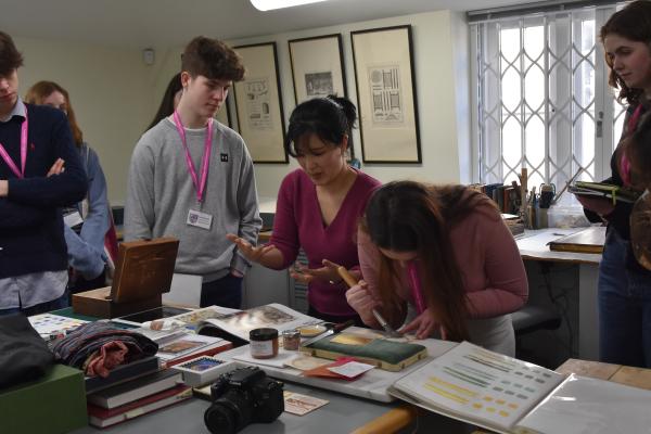 A student tries her hand at burnishing gold leaf guided by Mito Matsumaru (Book and Manuscript Conservator).